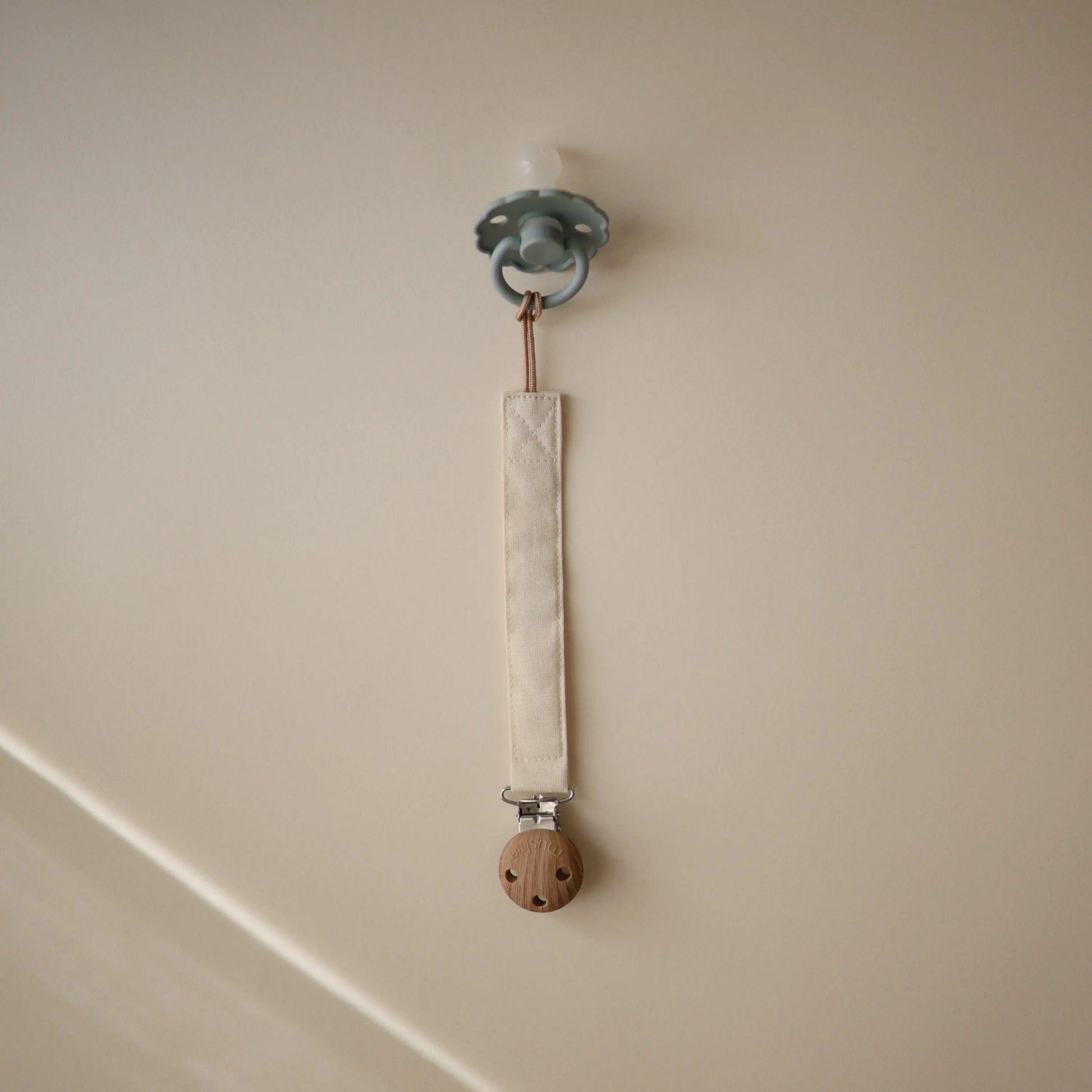 Linen Pacifier Clip Two Pack with Water Resistant Coating and Faux Wood Silicone Clasp Mushie