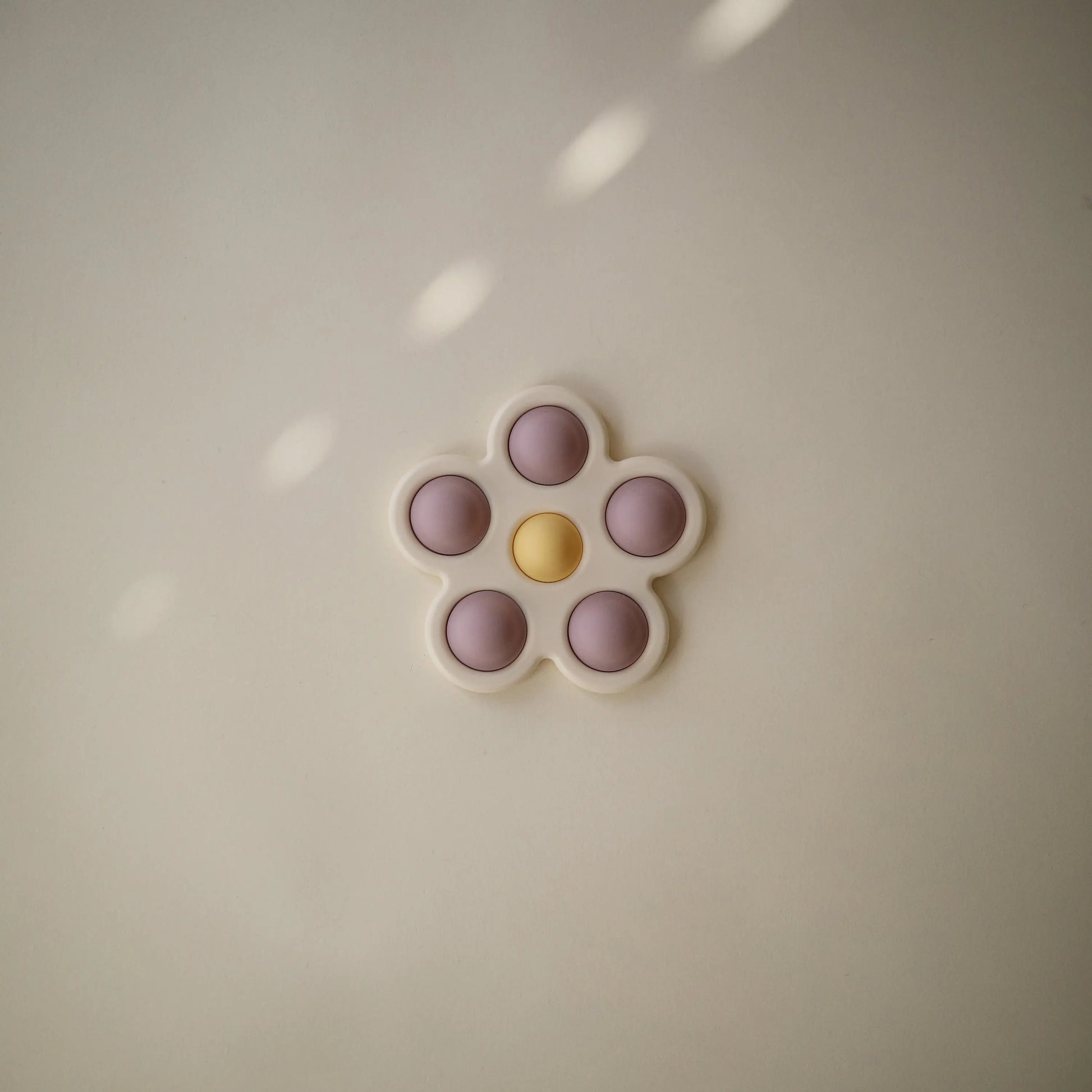 Flower Press Toy for Fine Motor Skills and Sensory Exploration Mushie Everetts Place: Online Boutique