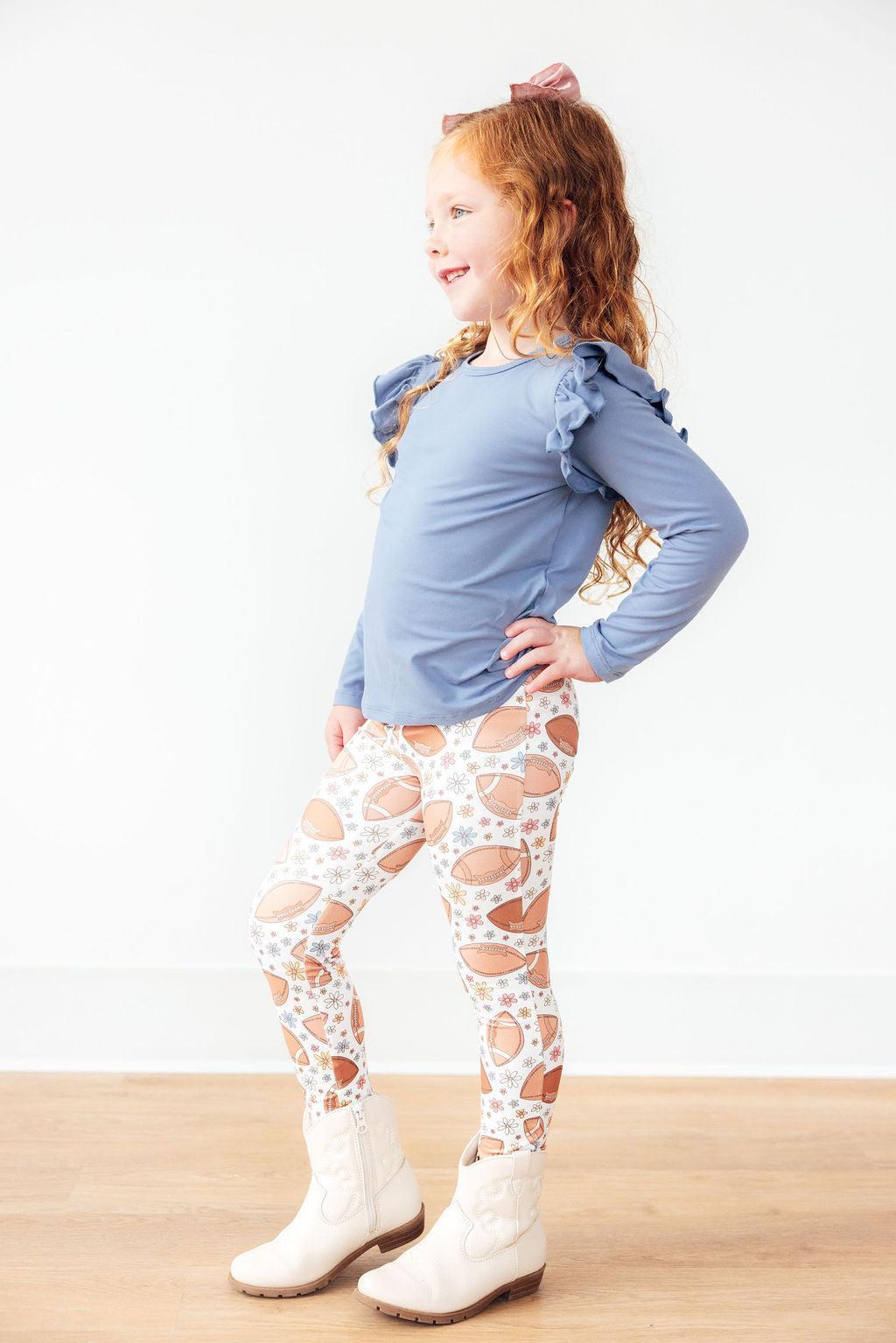 Mila & Rose Football Friday baby leggings with football print.