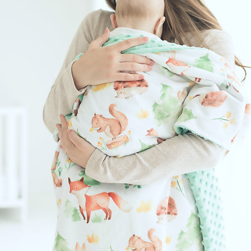 Baby & Toddler Minky Blanket with woodland animals and green minky texture, ideal for nursery or gift.