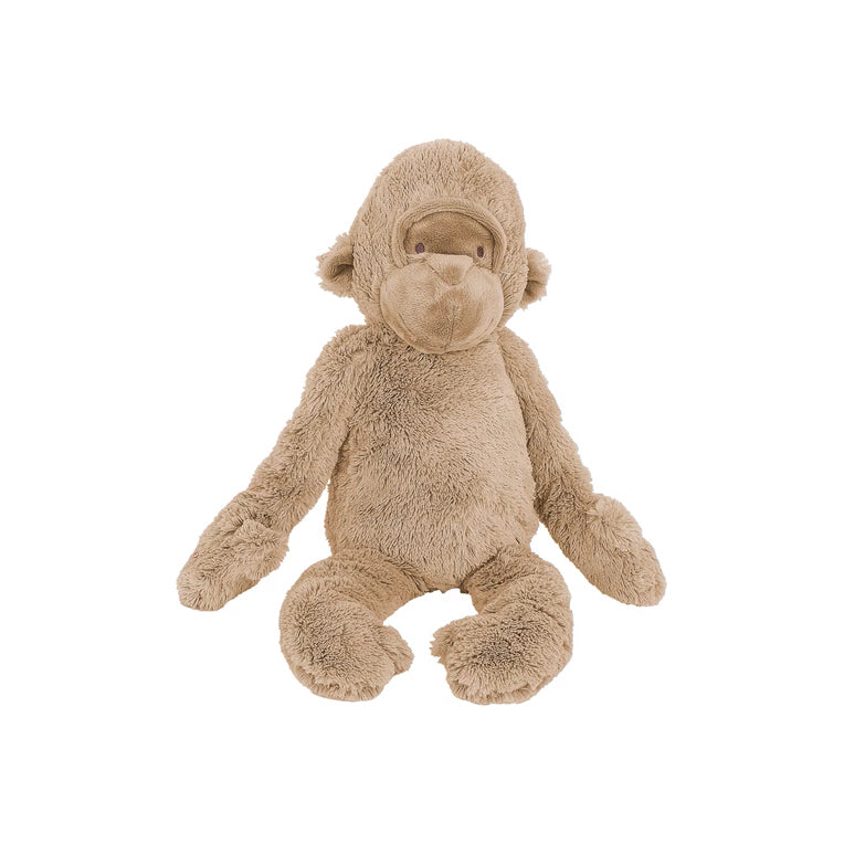Plush gorilla with tan fur, a soft nose, and sewn-in eyes, standing upright.