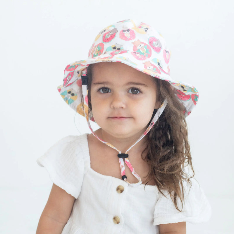 Baby & Kids Sun Hat - Child wearing colorful sun hat with playful design, perfect for beach outings and UV protection.