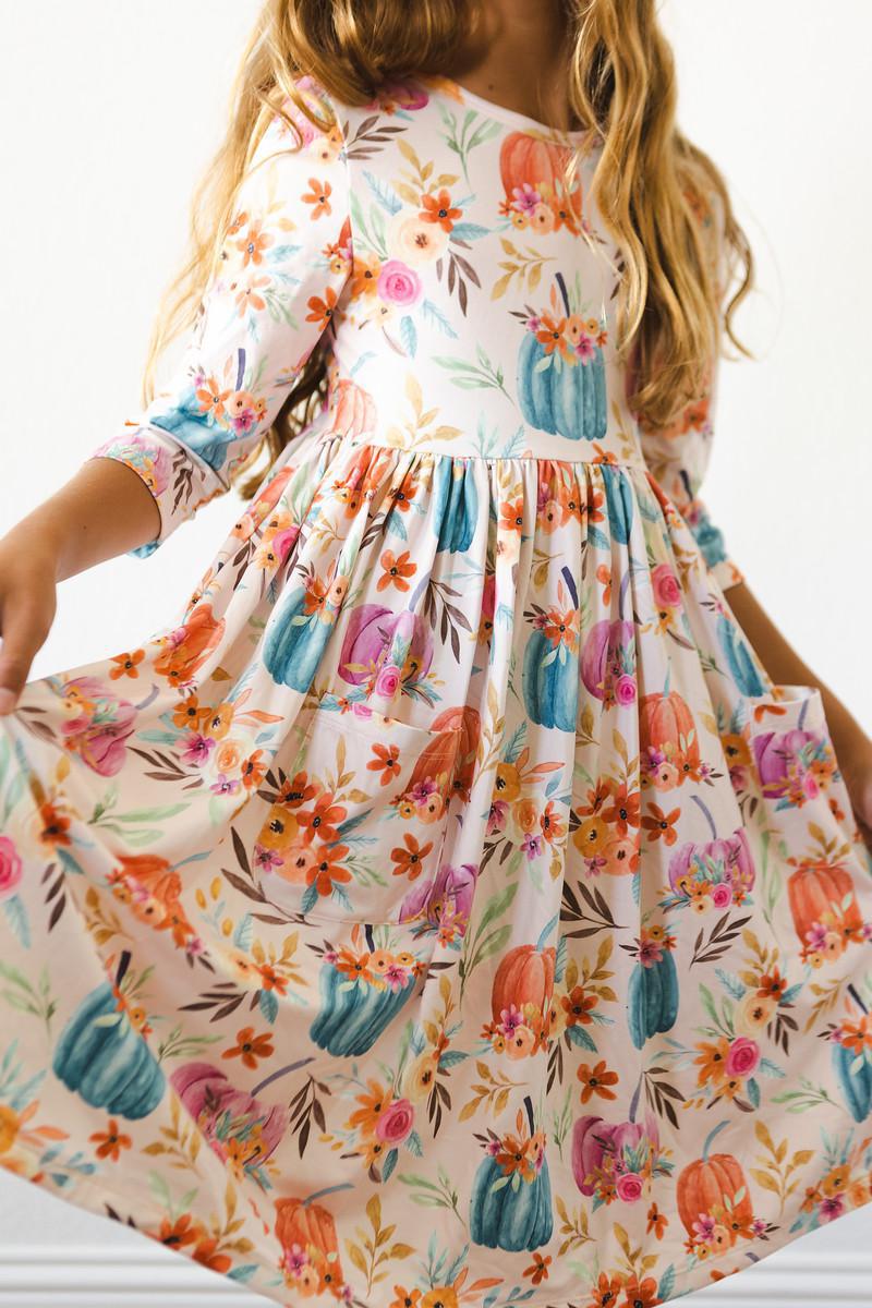 Twirl dress with harvest floral print, 3/4 sleeves, pockets, ballet neckline and full skirt