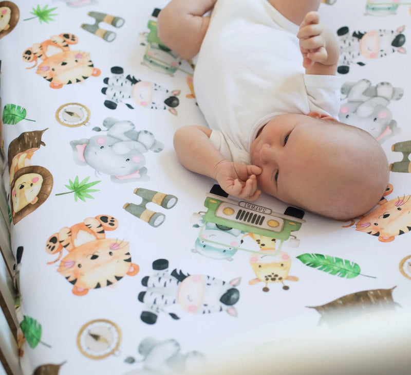 Safari themed fitted crib sheet with unique animal patterns, soft and perfect for photo backdrops.