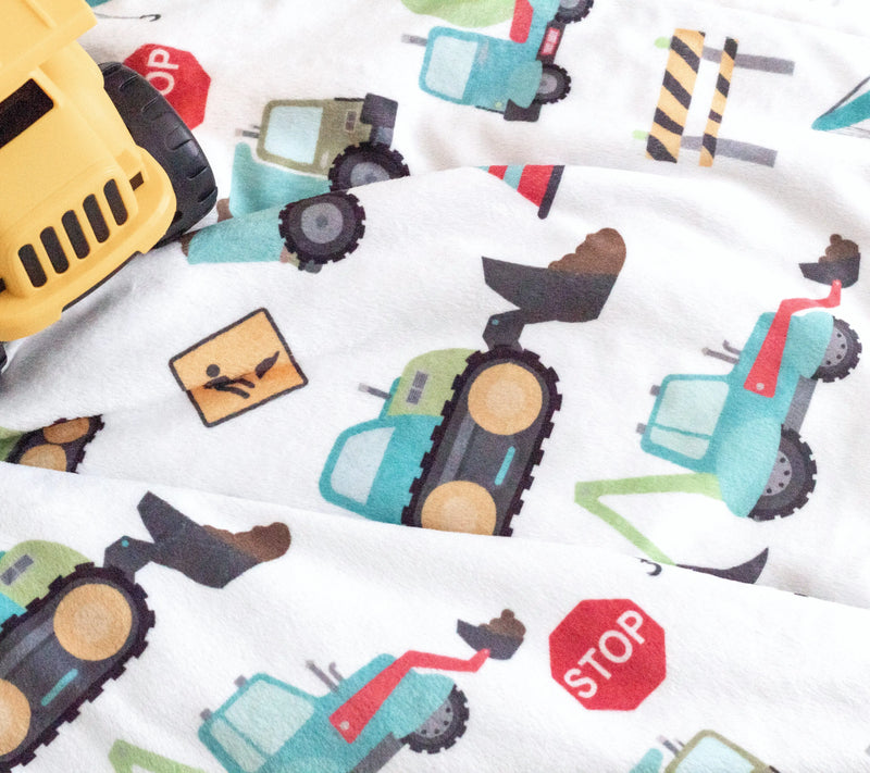 Baby & Toddler Minky Blanket with construction trucks print on premium soft fabric.