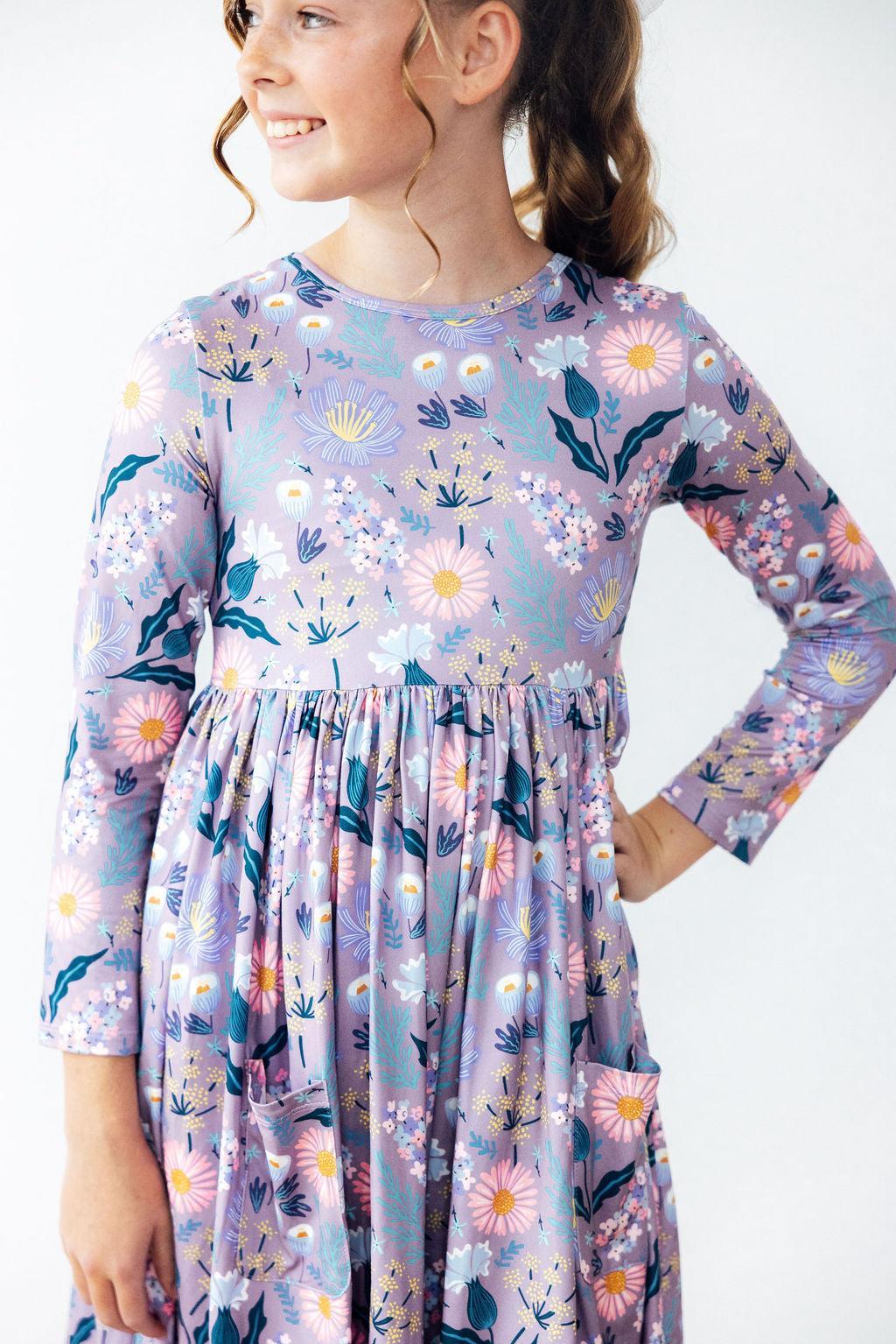 Long-sleeve twirl dress in honeysuckle print with a ballet neckline, full skirt, and side pockets