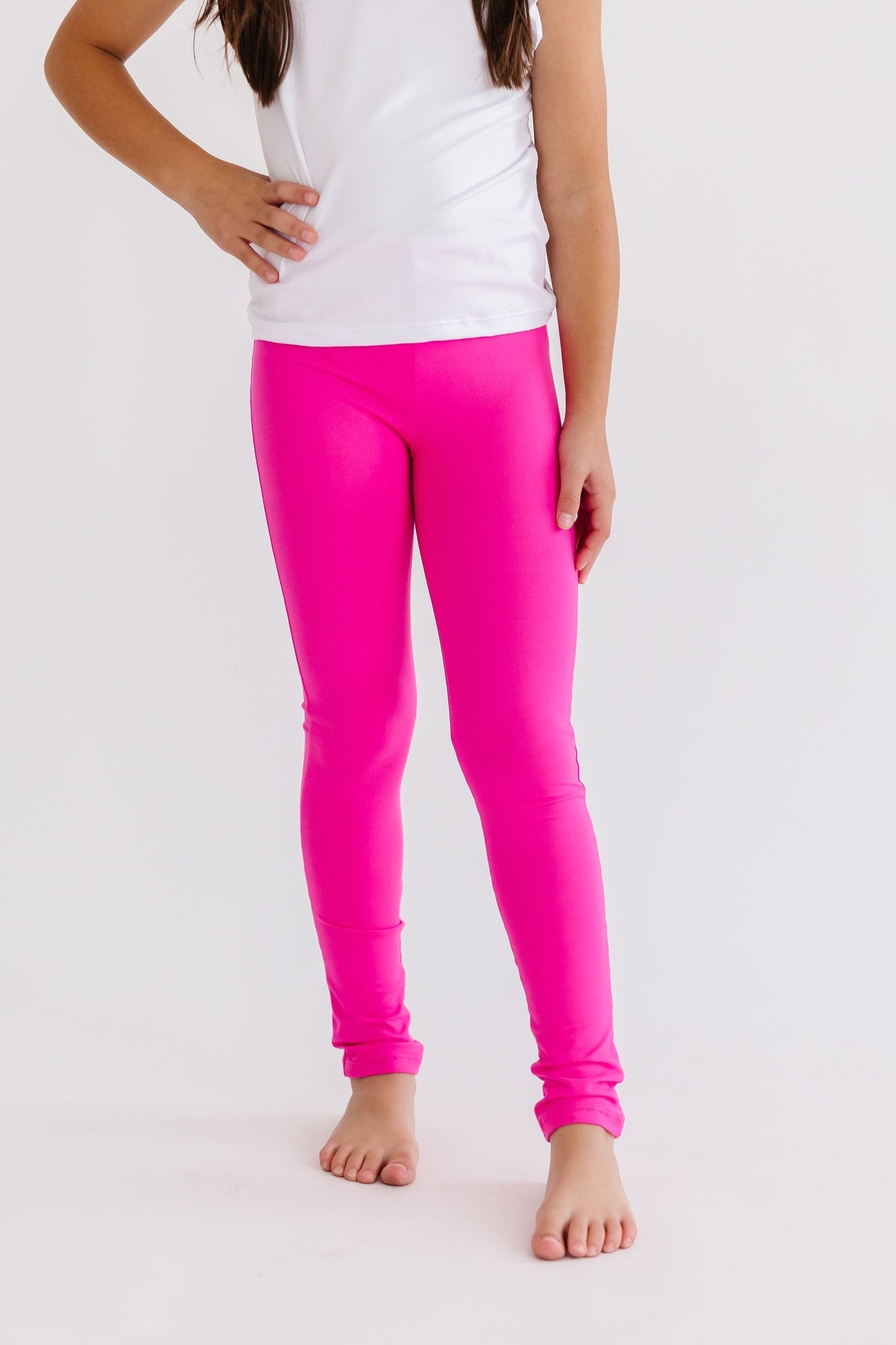 Mila & Rose comfy organic baby leggings in vibrant hot pink.