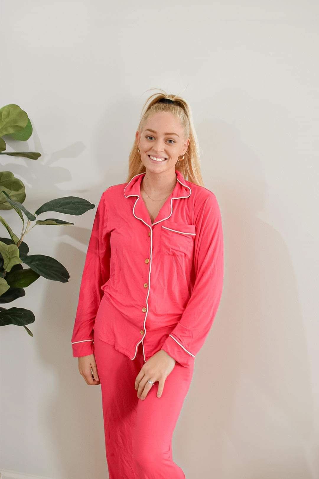 Adult button-up pajama top in a hibiscus floral print with a collar and front buttons.