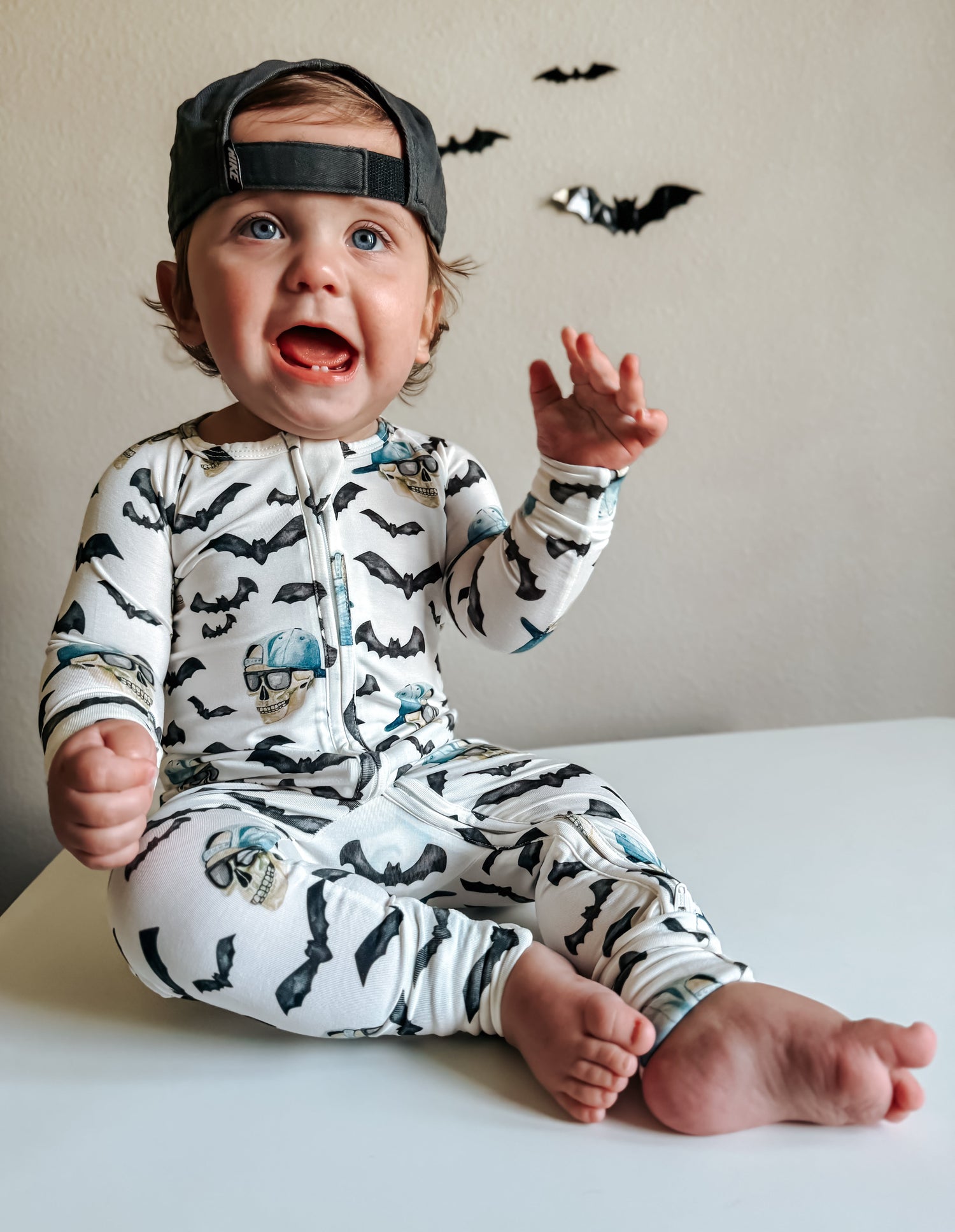 Footed baby zip pajamas with a Halloween spooky bro print and foldover cuffs.