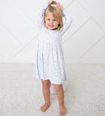 Pink long-sleeve toddler ballerina dress on a smiling child