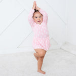 Long-sleeve bodysuit dress with a whimsical fairies print and snap closure at the inseam