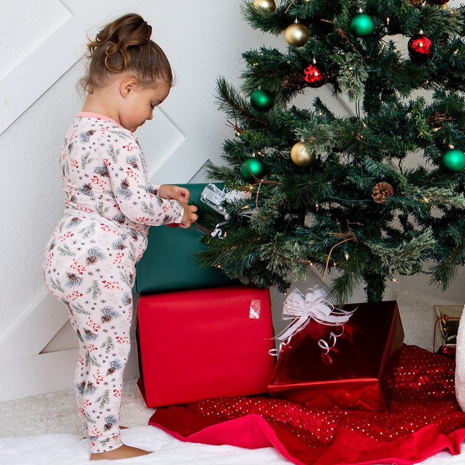 Two-piece long-sleeve baby pajamas with a pine tree pattern, matching top and pants.
