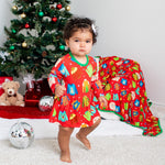 Long-sleeve baby bodysuit dress with a festive ugly-sweater holiday design and snaps at the inseam.