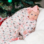 Baby footie pajamas with a pine tree pattern in pink, full-length zipper, and covered feet