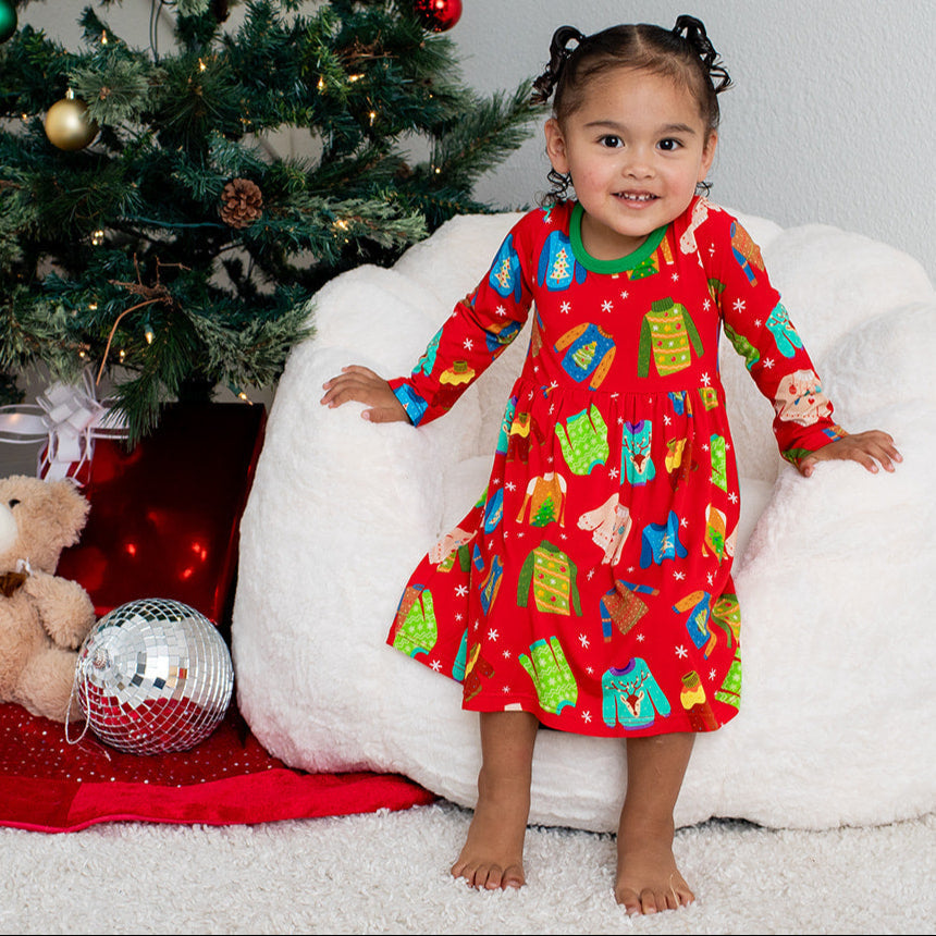 Long-sleeve toddler party dress with a festive ugly sweater holiday print and twirl skirt