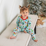 Long-sleeve baby pajama set with a festive holiday Christmas print top and matching pants.