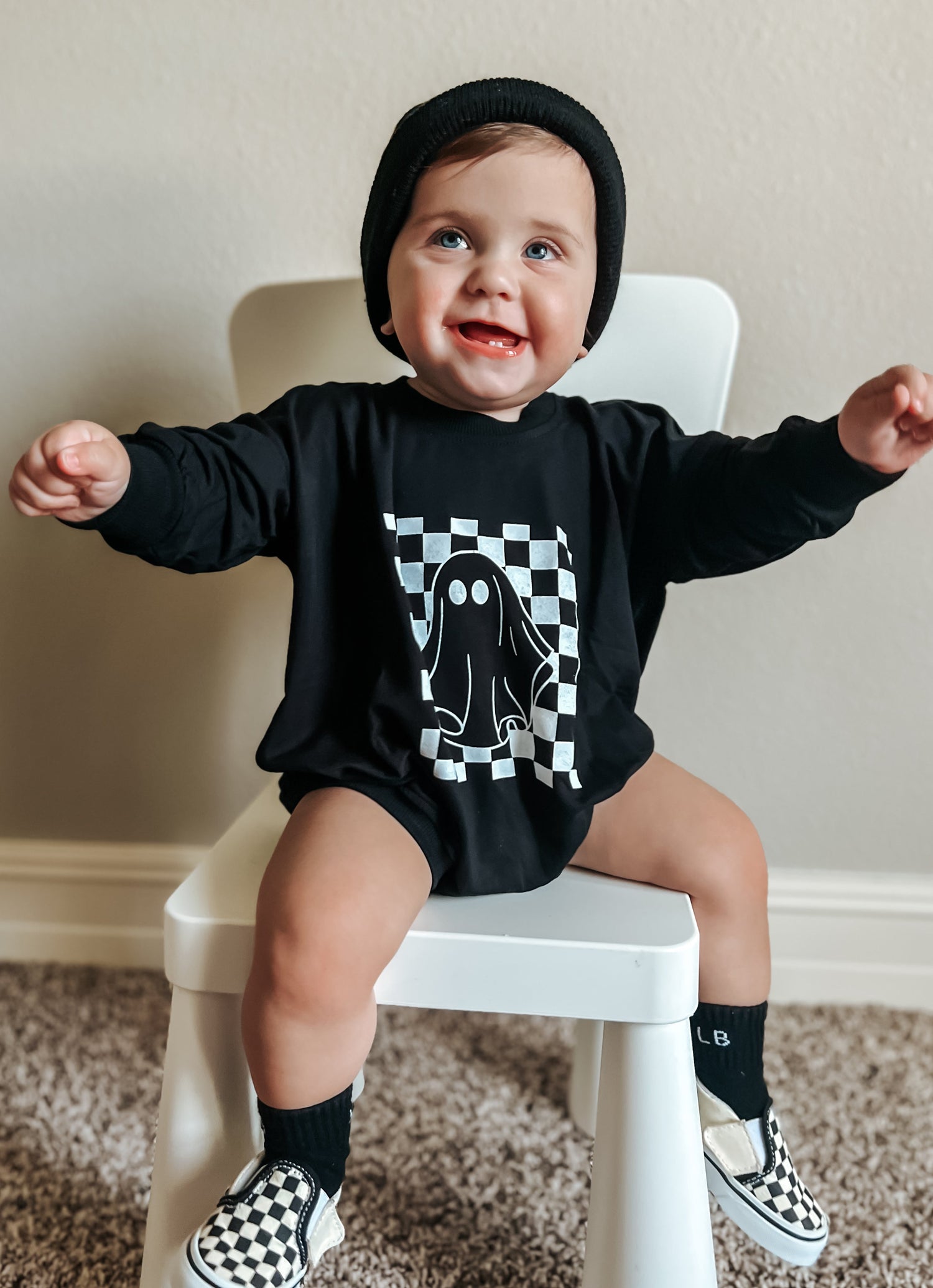 Bubble romper with checkered ghost print and snaps at the crotch