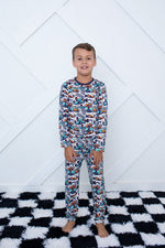 Two-piece long-sleeve baby pajama set with matching top and pants in the Apex Dreams print.