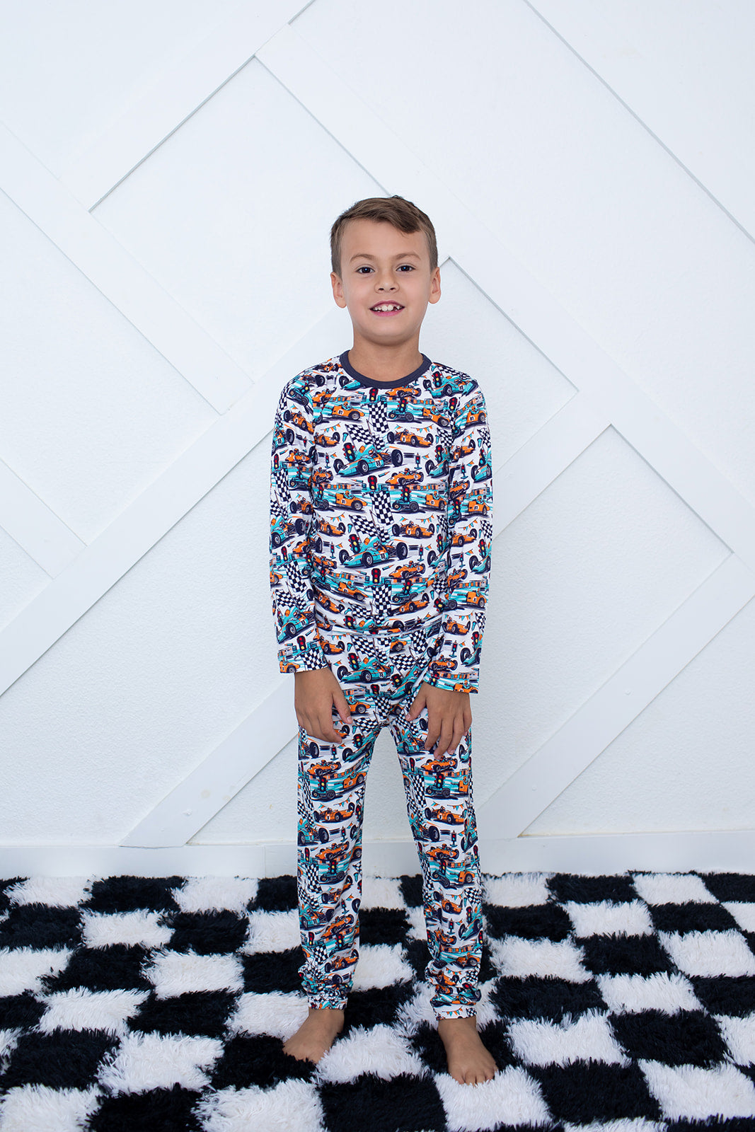 Two-piece long-sleeve baby pajama set with matching top and pants in the Apex Dreams print.