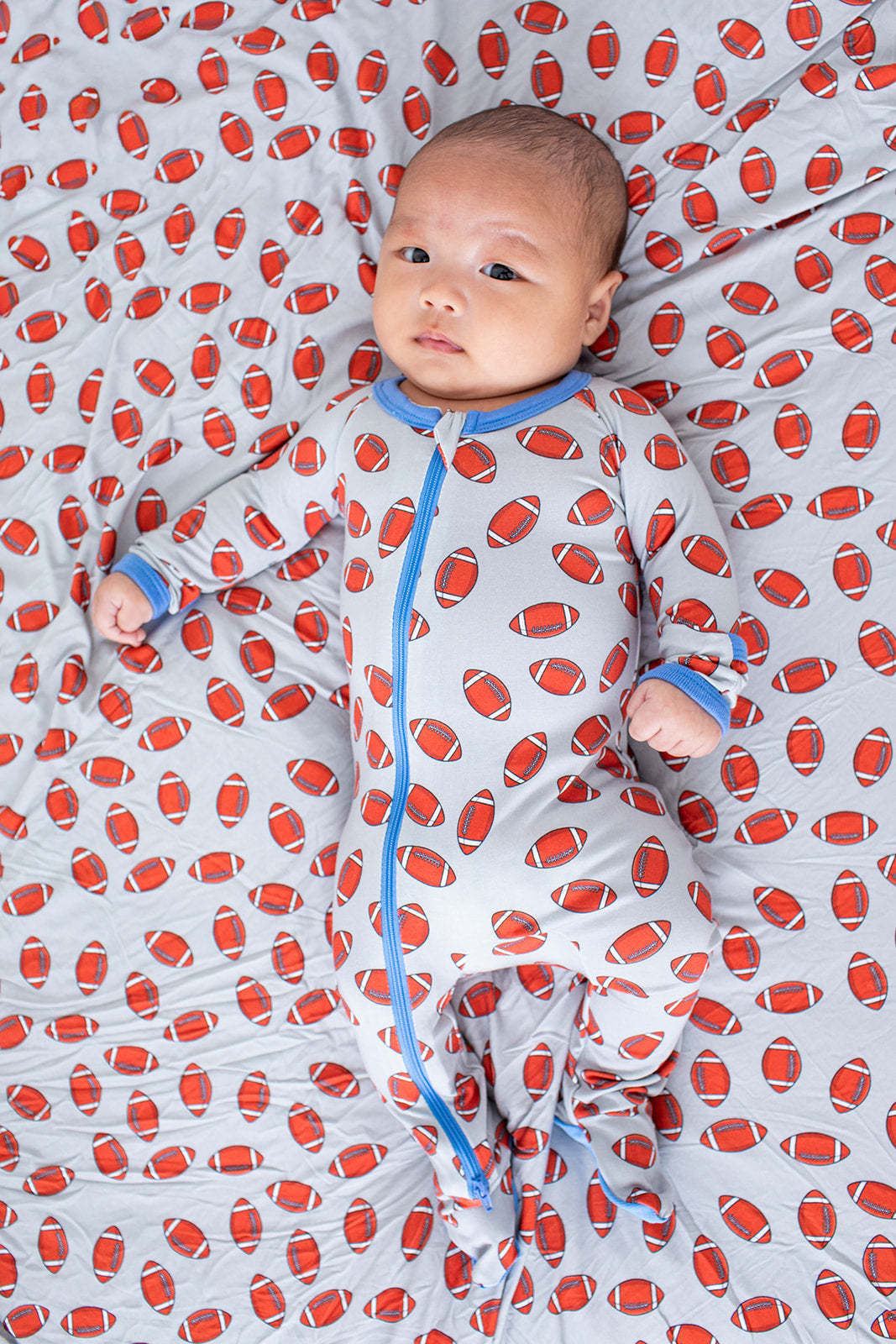 Baby footie pajamas with full-length two-way zipper and covered feet