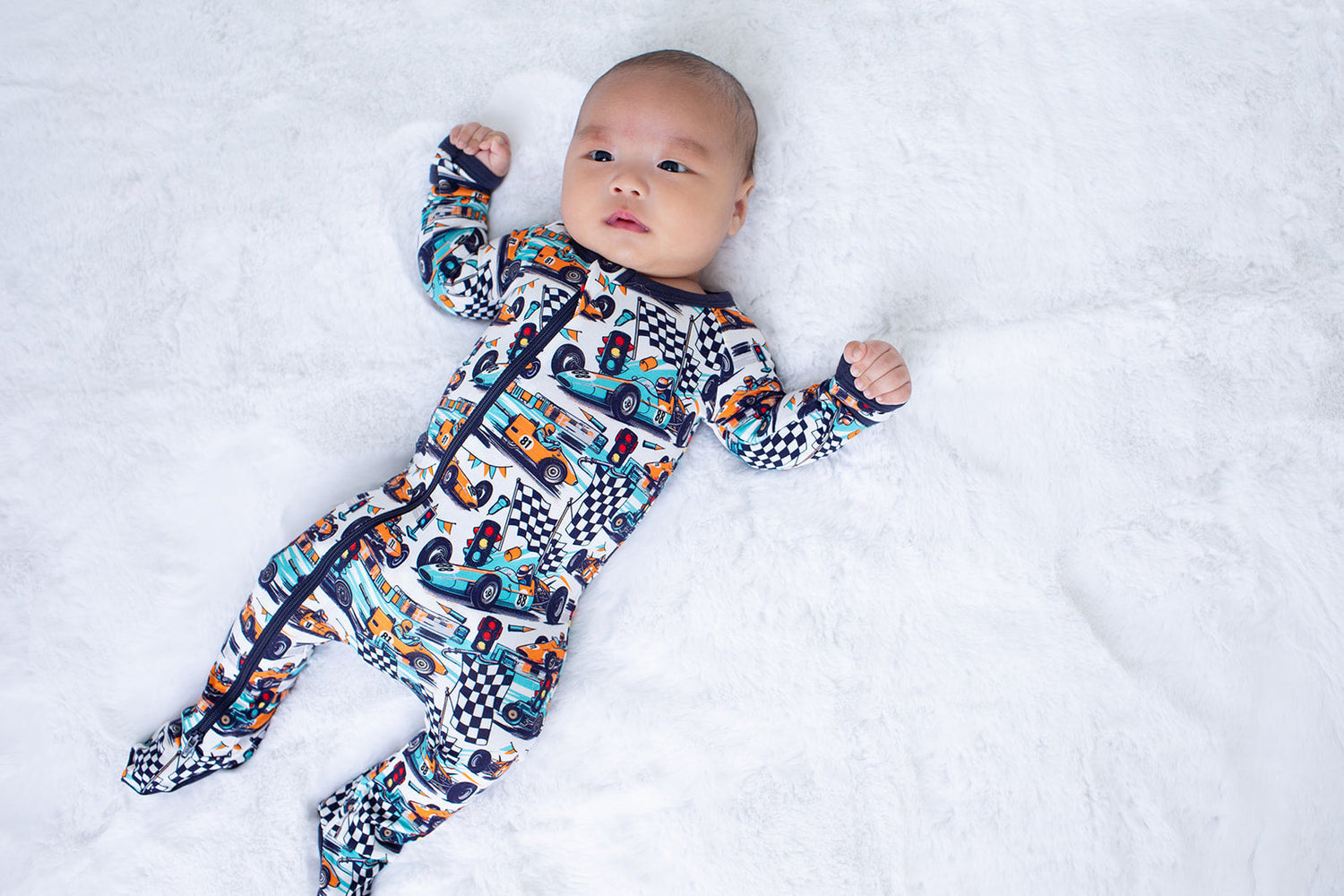 Baby footie pajamas in the Apex Dreams print with a full-length front zipper and covered feet