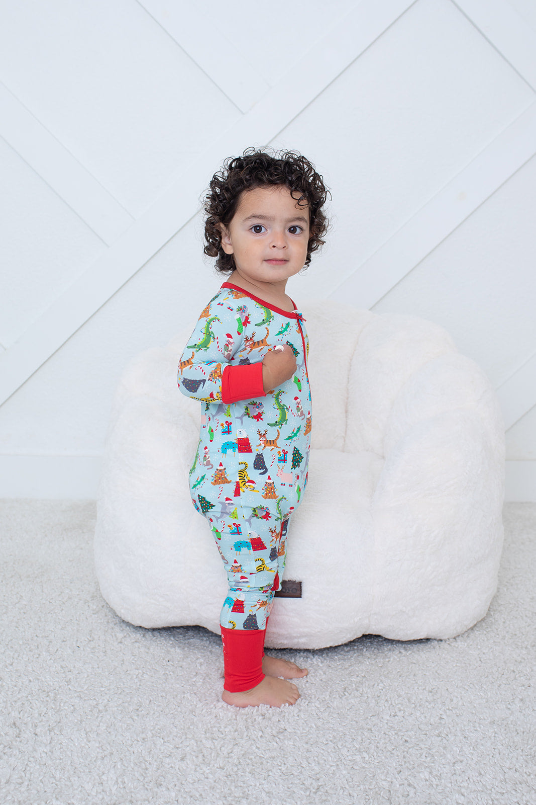 Convertible baby coverall in a crackling Christmas holiday print with a full-length front zipper and footed legs.