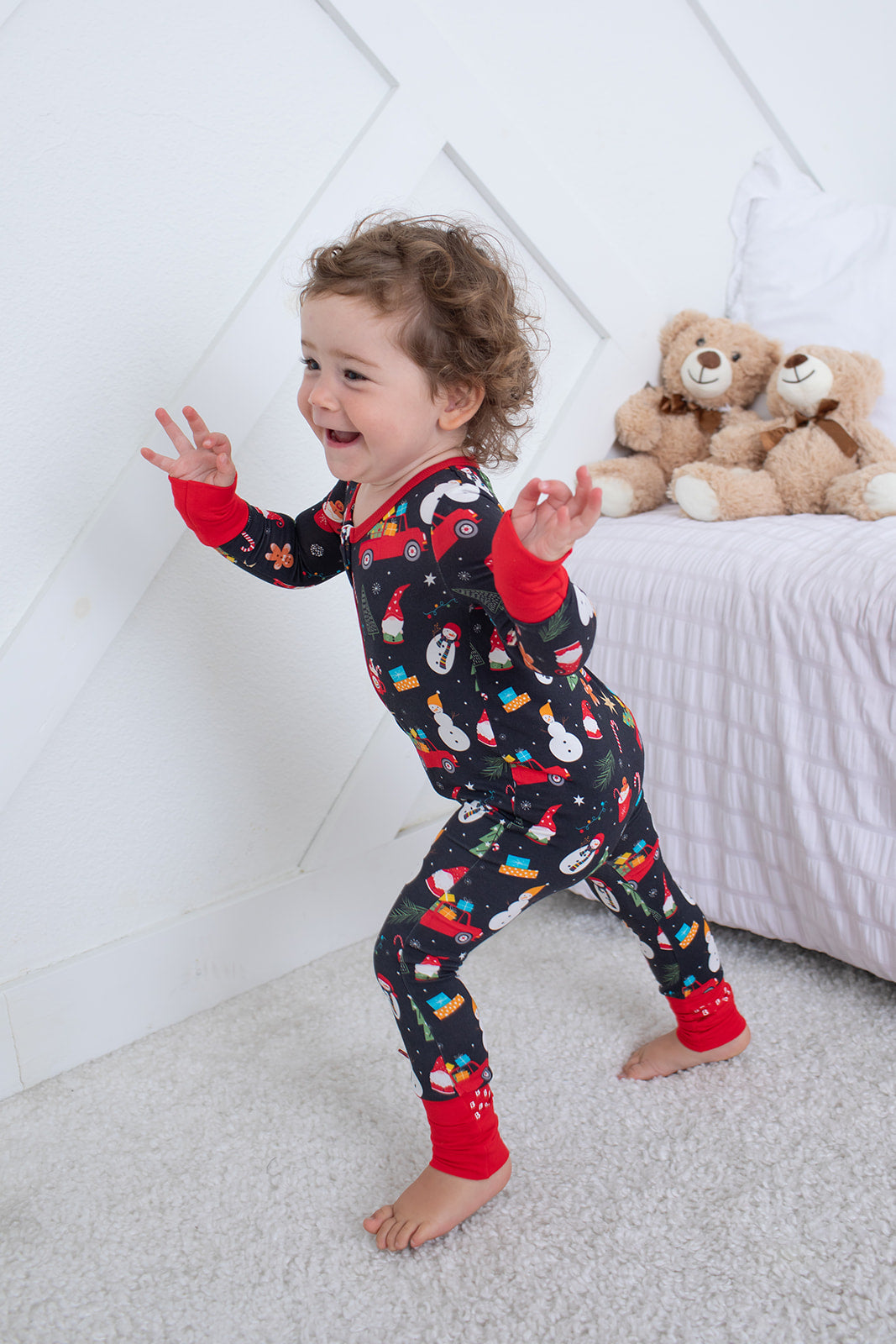 Baby coverall with a festive holiday print, long sleeves, and a full-length front zipper