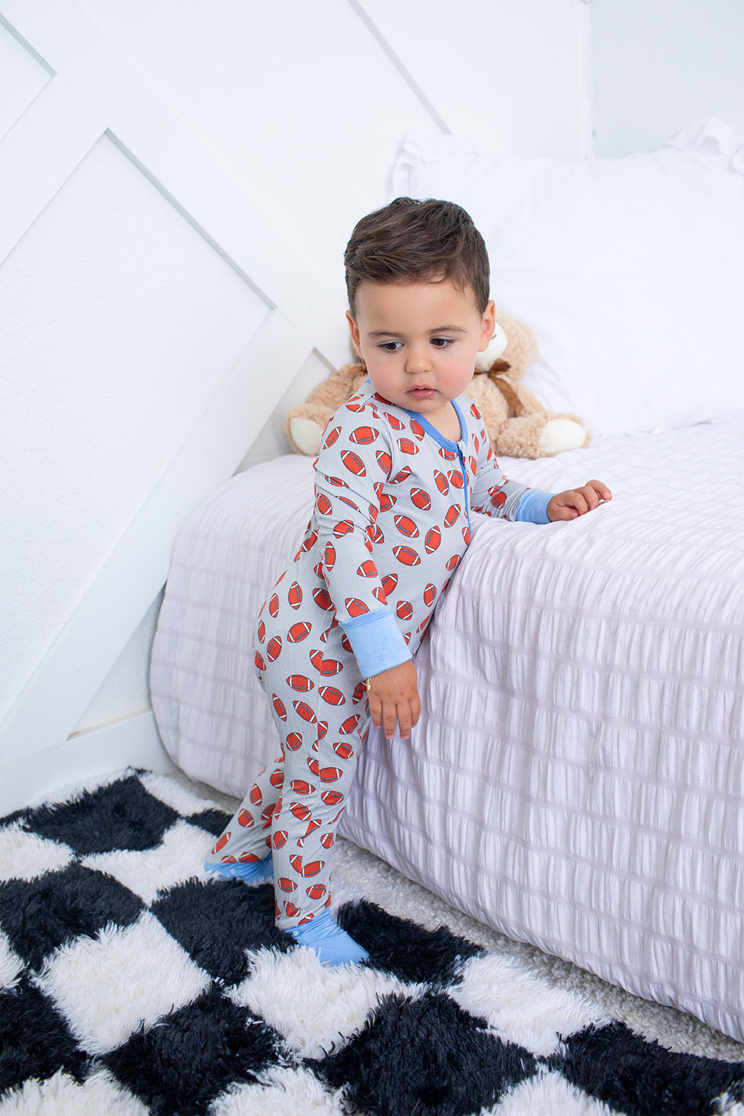 Convertible coverall in a playful huddle-up print with long sleeves and zipper front