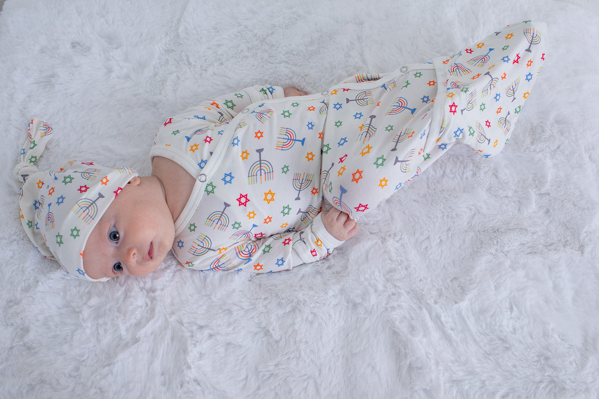 Baby convertible gown and matching hat in a Happy Hanukkah print, with fold-over cuffs and bottom