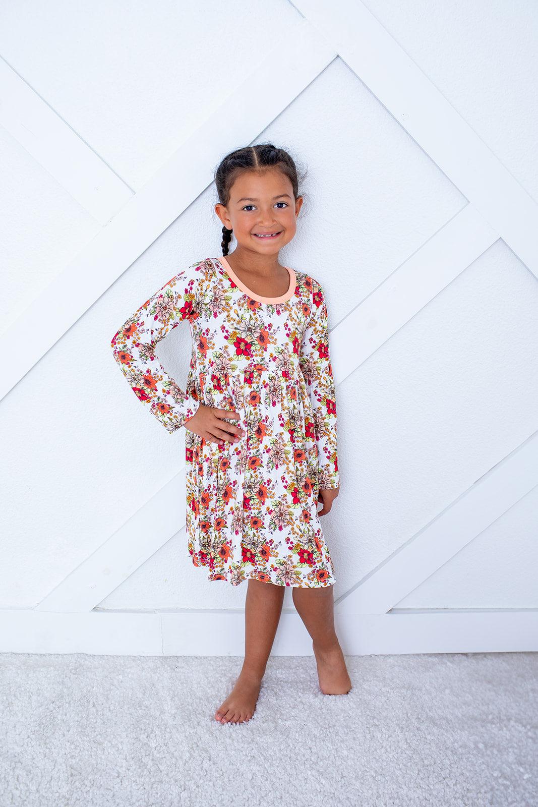 Long-sleeve toddler dress in a soft pink floral Honeyblossom pattern with a full twirl skirt