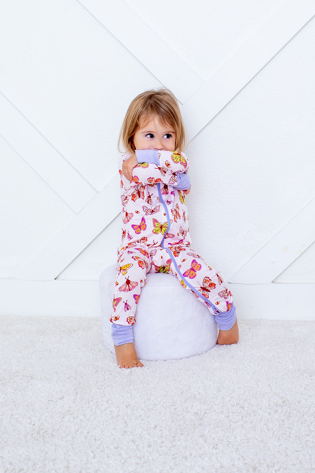 Baby coverall in pink floral ButterBloom print with long sleeves, zipper front, and covered feet