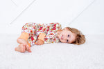 Baby convertible coverall in a honeyblossom floral print with a full-length two-way zipper and footed legs