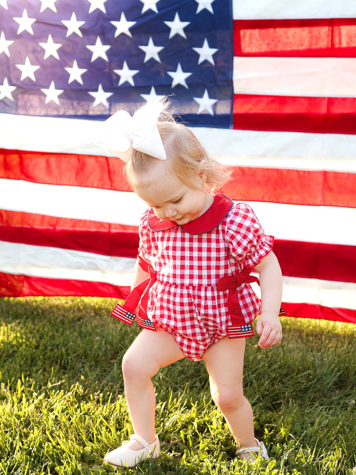 4th of July Flag Plaid Girl Peter Pan Collar Romper Bow by Rylee Faith Designs at Everetts Place