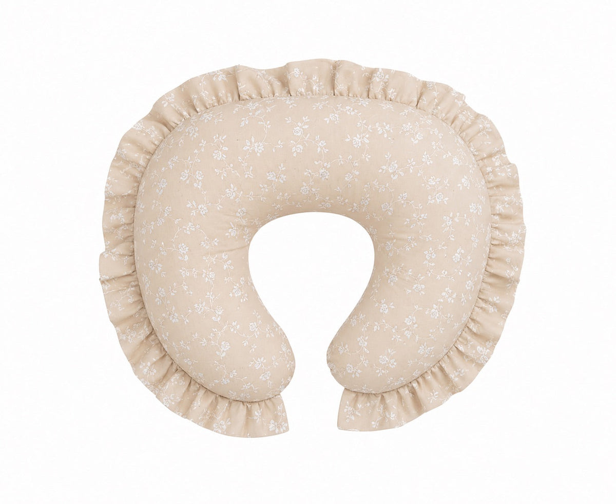 Nursing pillow cover in beige with white floral print and ruffle trim along the edge