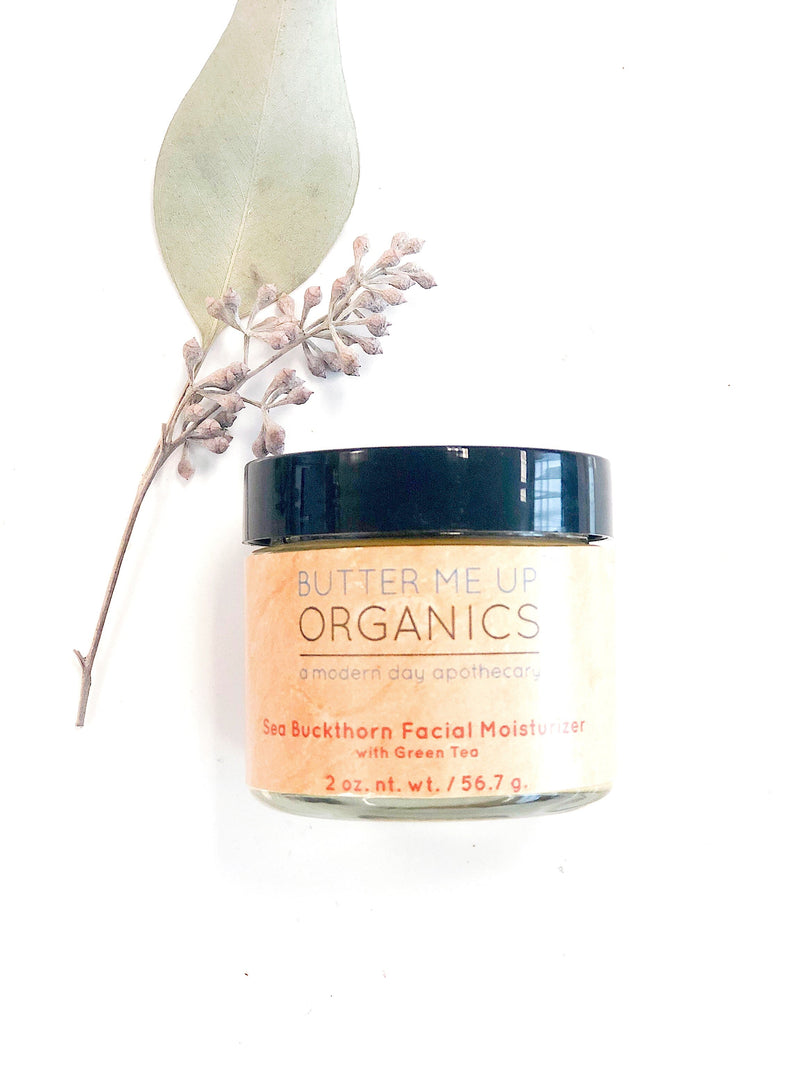 Sea Buckthorn Facial Moisturizer in glass jar with leaf accent, organic skincare.