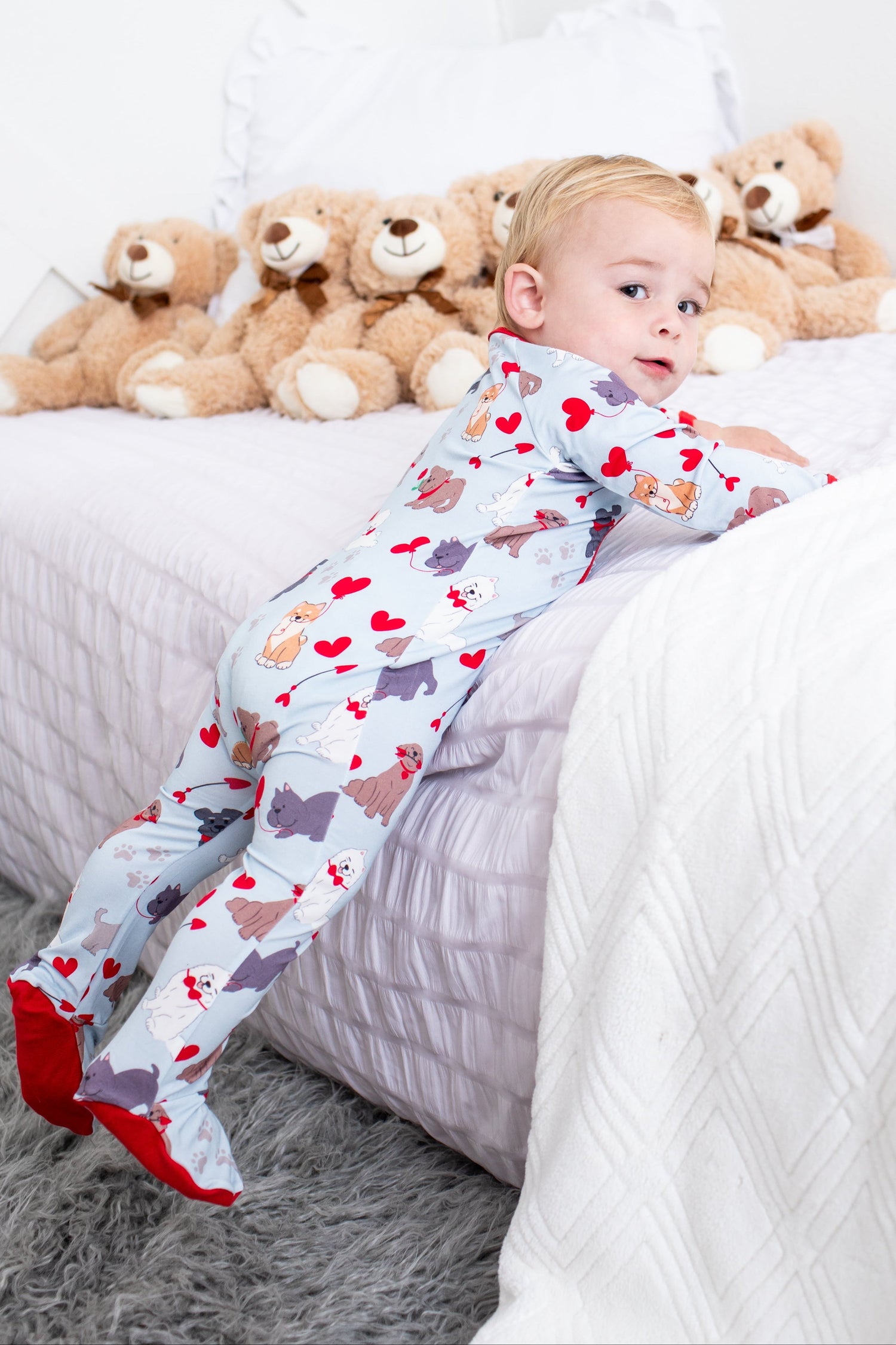 Baby footie pajamas with an allover puppy print and a full-length front zipper