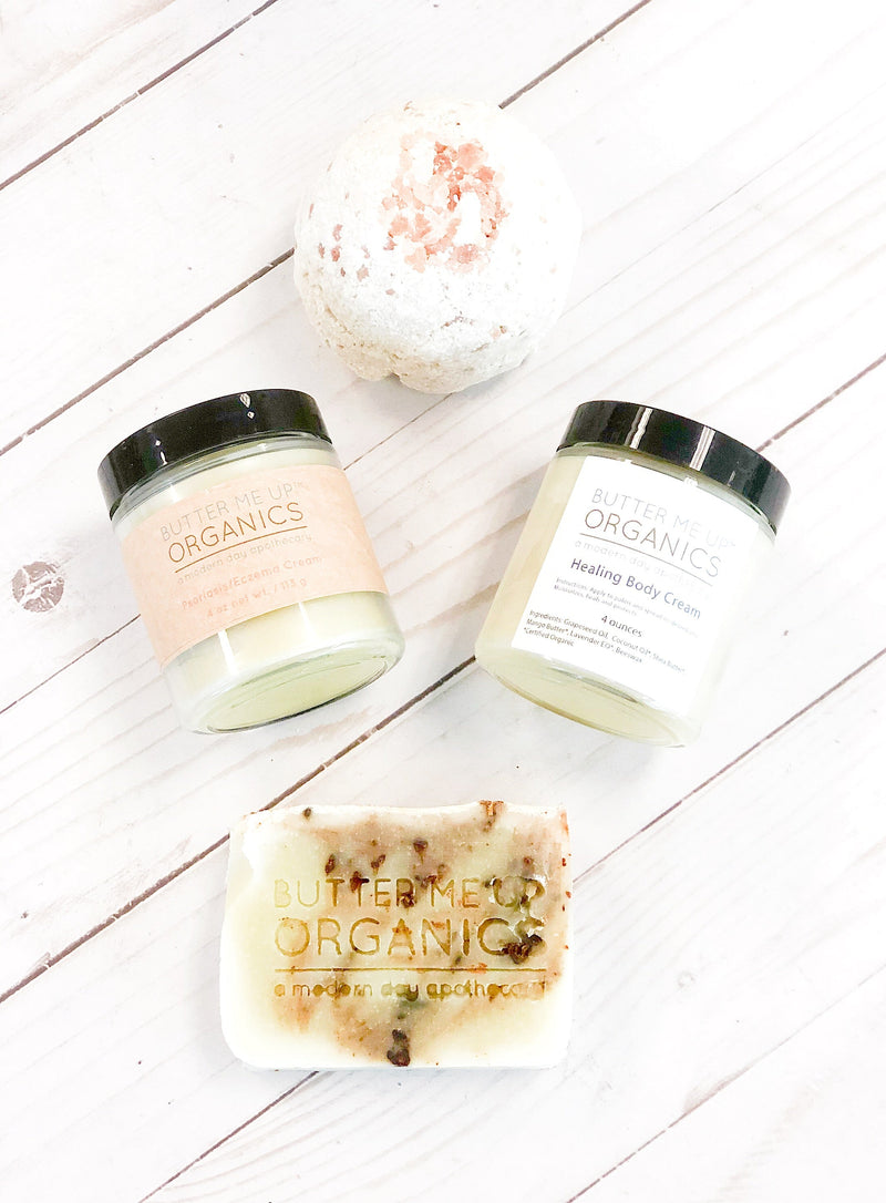 Sensitive Skin Gift Set with cream, bath bomb, and organic soap on a light wood background.