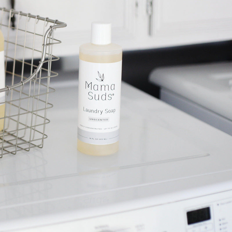 Nontoxic MamaSuds Laundry Detergent Soap bottle on washing machine.