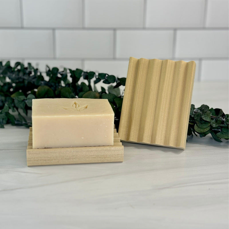 Wooden Ridged Soap Dish made from sustainable bamboo with a soap bar, designed for eco-friendly water drainage.
