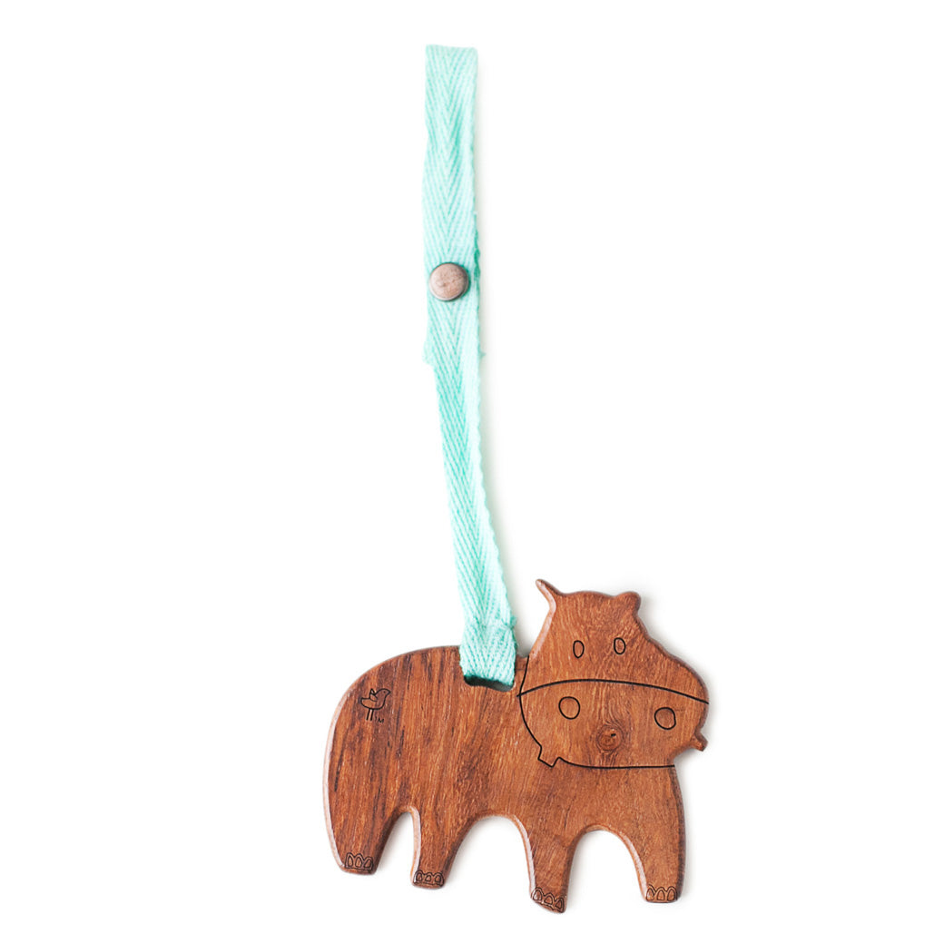 Modern Nursery natural wood baby play gym with organic hanging toys.