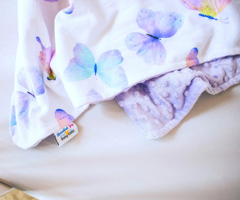 Butterfly-themed baby and toddler blanket with vibrant colors and soft minky dot texture.