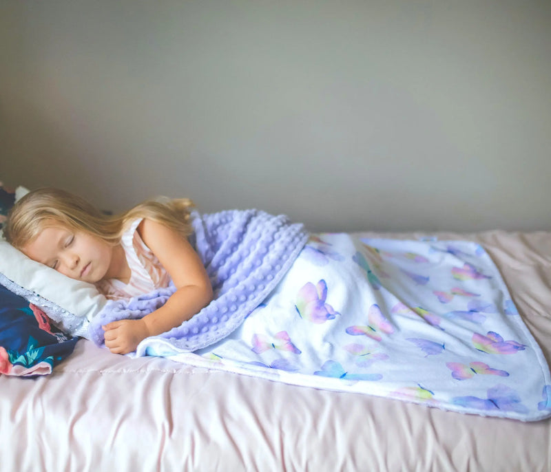 Soft butterfly-themed baby and toddler blanket for sensory stimulation and easy washing.