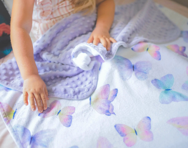 Premium baby and toddler butterfly blanket with soft minky dot texture and vibrant design.