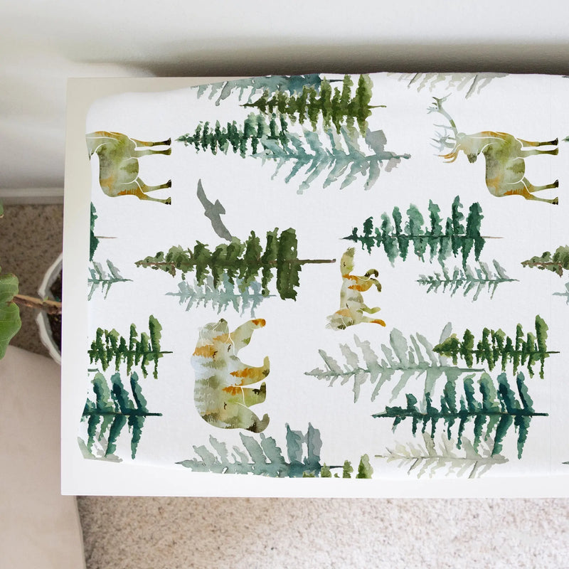 Changing pad cover with woodland design, soft and stretchy fabric, 32x16 inches.
