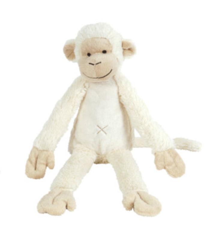 Ivory-colored plush monkey stuffed animal with soft fur and floppy arms and legs