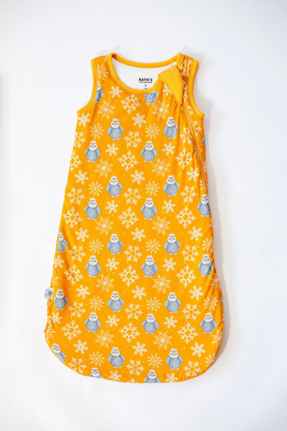 My First Snow Fall - Penguin Sleep Sack In Purple & Gold by Rayn’s Tiny Stitches