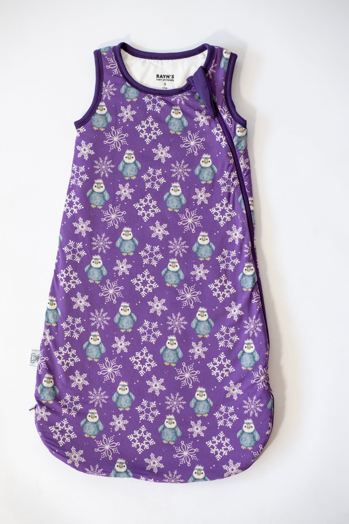 My First Snow Fall - Penguin Sleep Sack In Purple & Gold by Rayn’s Tiny Stitches