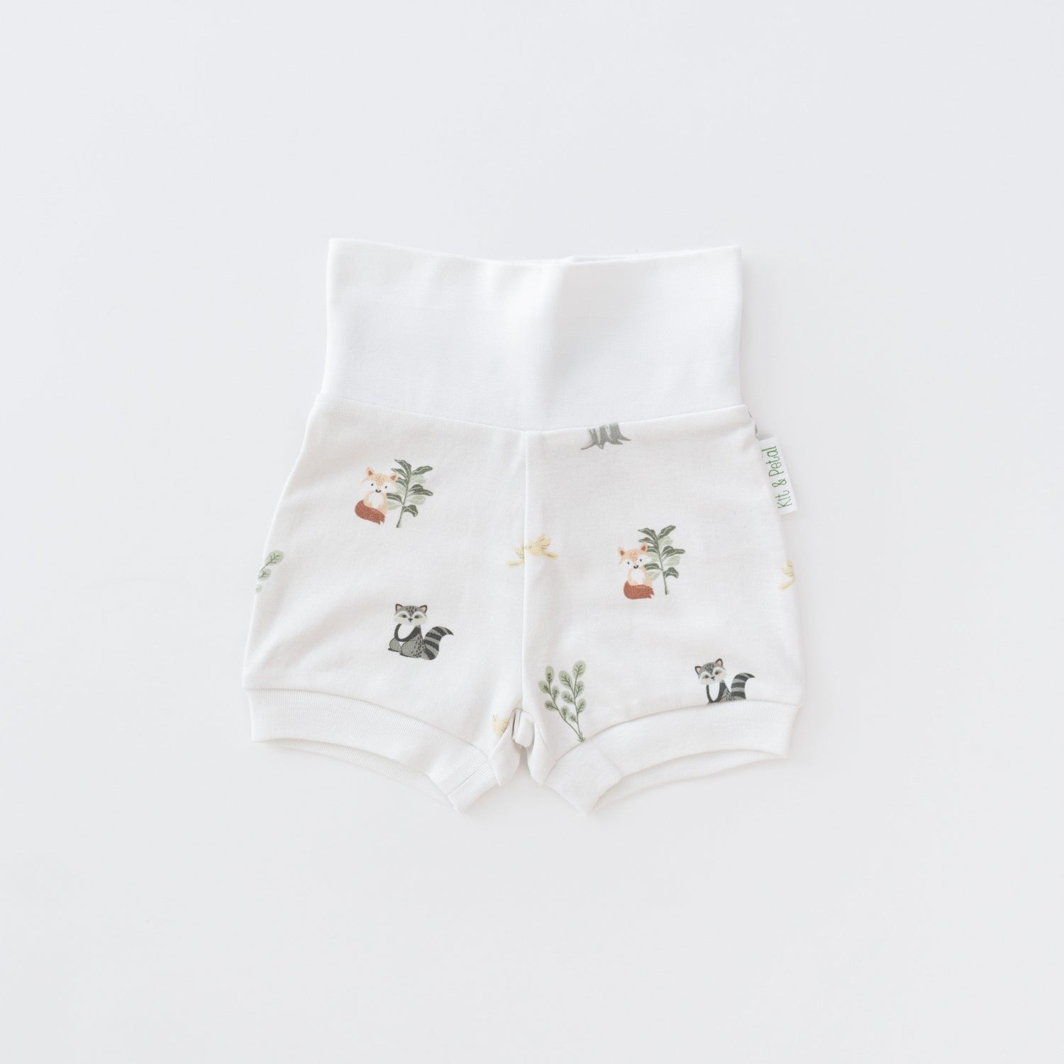 Baby fold-over waistband shorts in an animal-themed forest friends print made of organic cotton.