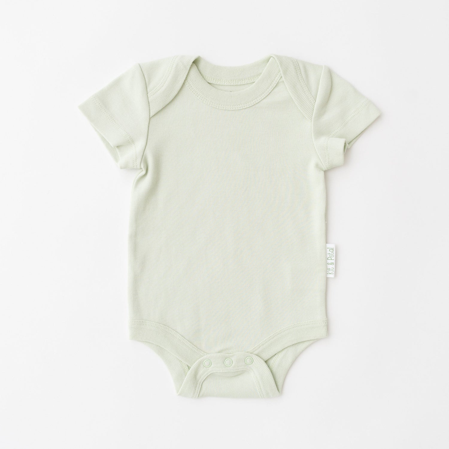Short sleeve baby bodysuit in leafy green with envelope neckline and snap buttons at the bottom