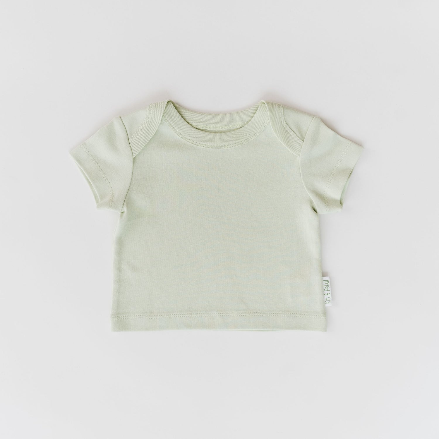 Short sleeve baby shirt in leafy green with an envelope neckline